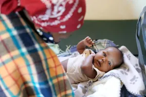 pediatric checkup for a six-week-old baby at PIH-supported Nkau Health Center