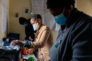 Treatment supporter prepares medications