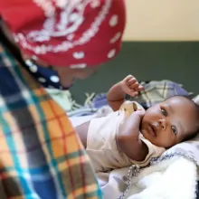 pediatric checkup for a six-week-old baby at PIH-supported Nkau Health Center