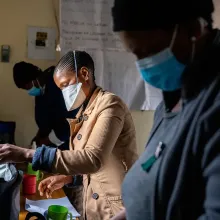 Treatment supporter prepares medications